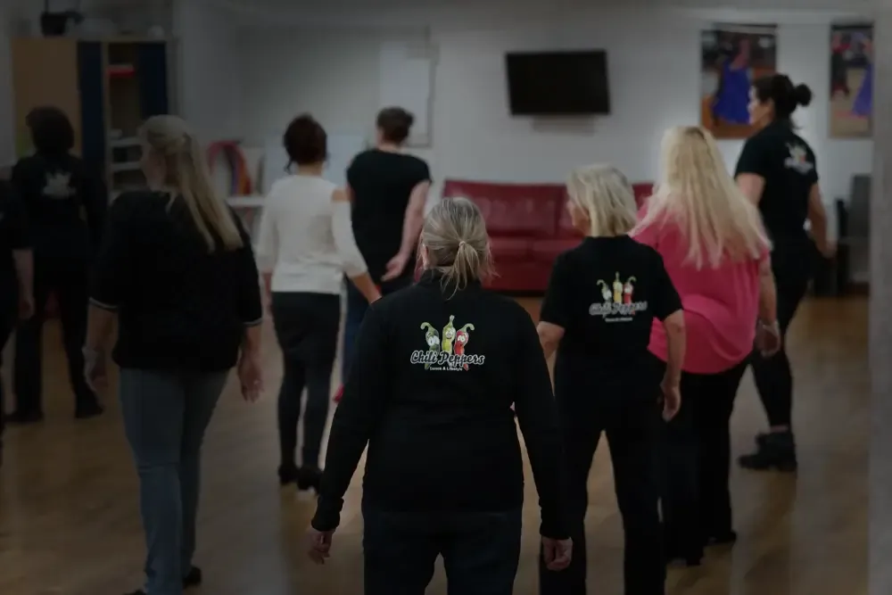 People dancing in the club room